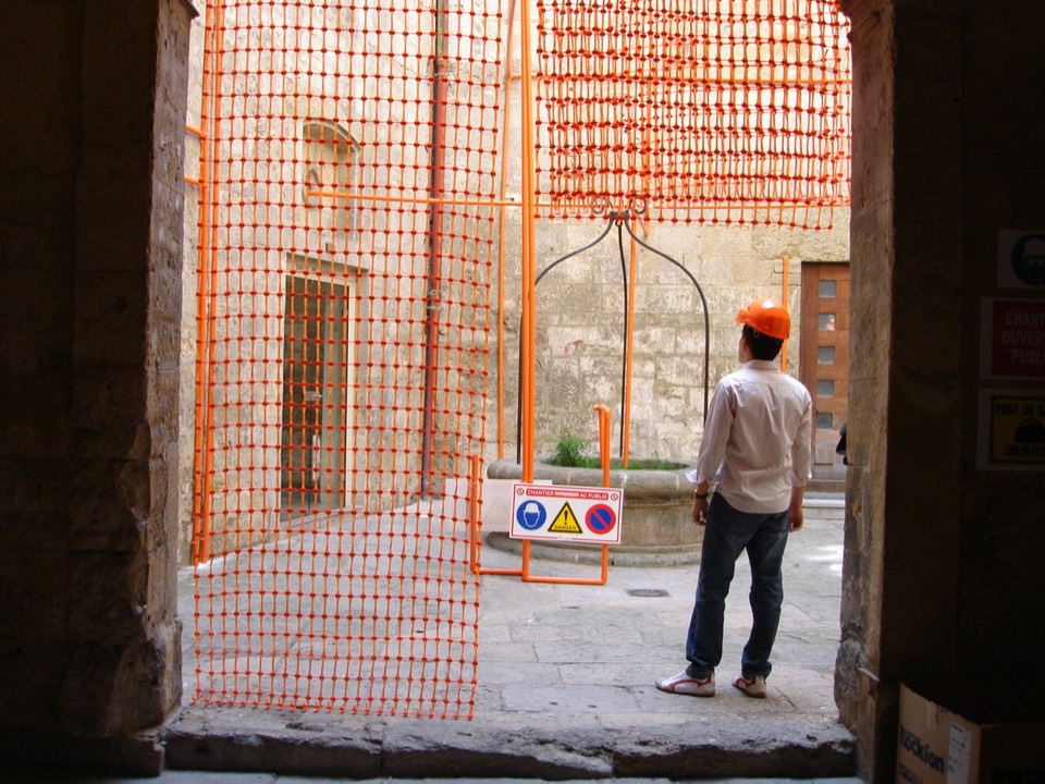 Repurposed construction site materials assembled in the courtyard.