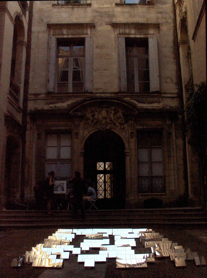 Mirrors assembled on the ground of the courtyard to reflect the relationship to the sky.